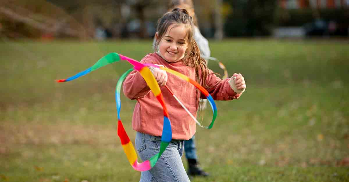 Little girl enjoying outdoor games