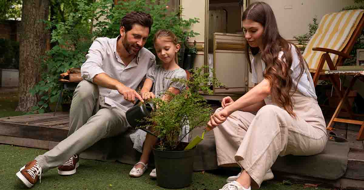 Parents and daughter spending time together in backyard