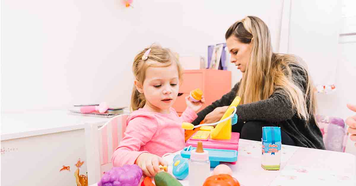 Mother and daughter playing with toys