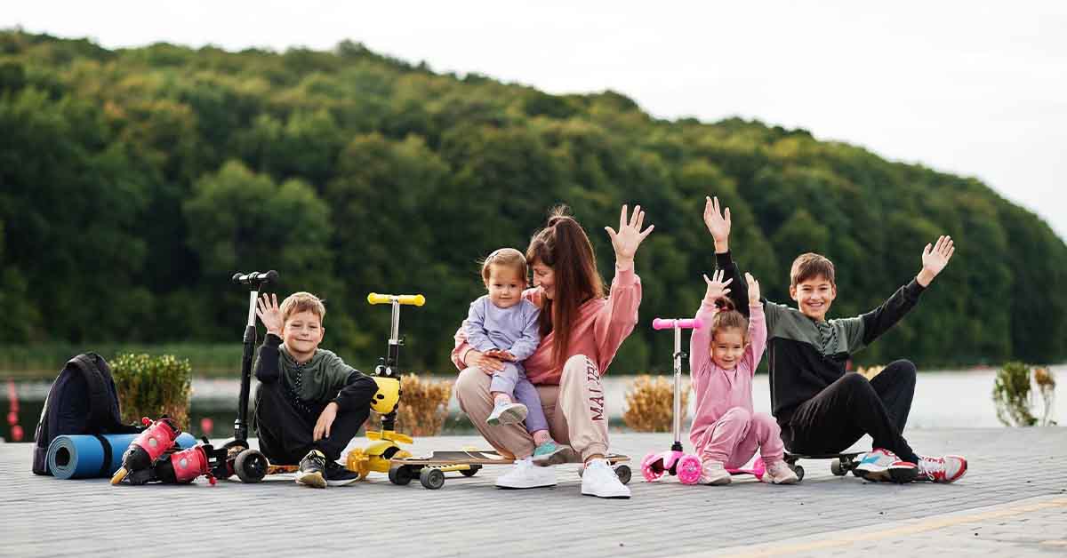 stylish mother with four kids outdoor sports family spend free time
