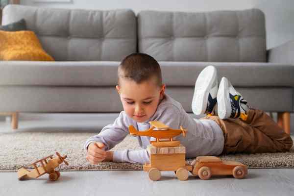 Boy playing with toy car sets
