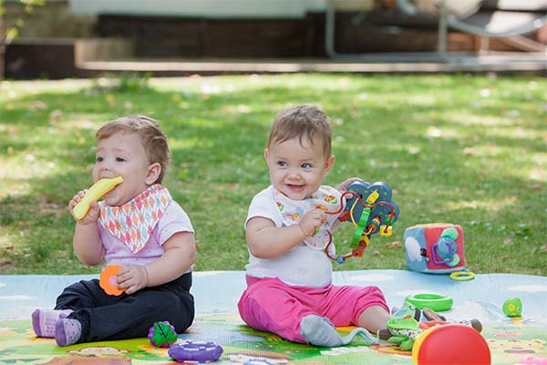 Babies playing with teething toys
