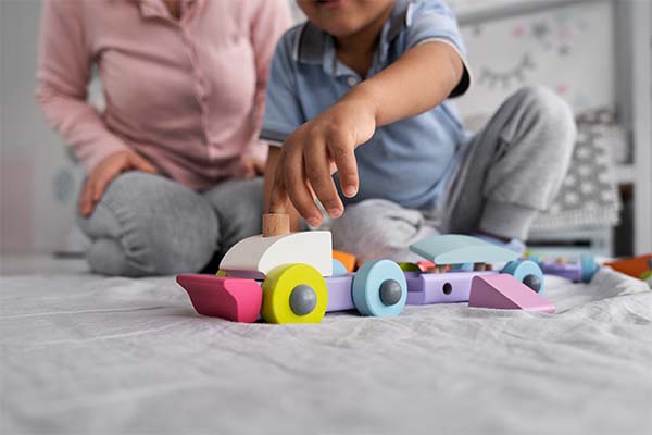 child playing with didactic game