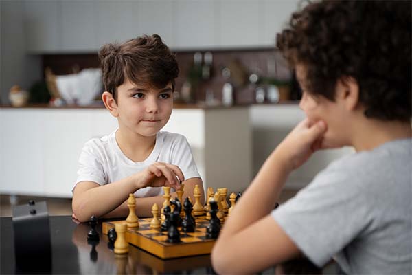 Two boys playing chess 