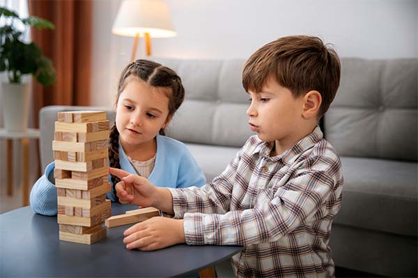  kids playing together at table