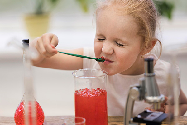 Girl performing science-based activities  