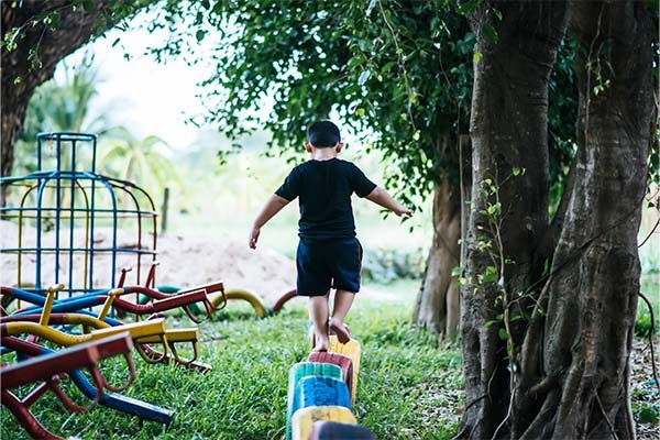 Boy enjoying outdoor games in backyard 