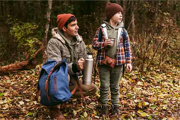 Father and son enjoying nature outdoors