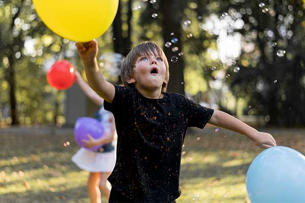 Boy playing solo outdoor games