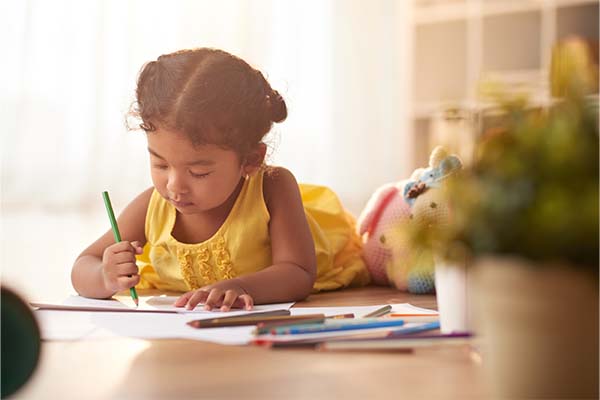 Child's Handwriting: Little Girl Focused on handwriting