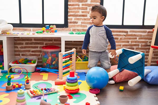 Baby boy playing with toys
