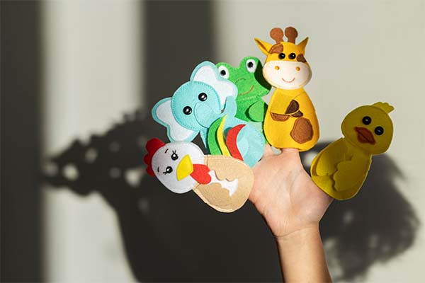 Little girl playing with eco-friendly toys at home