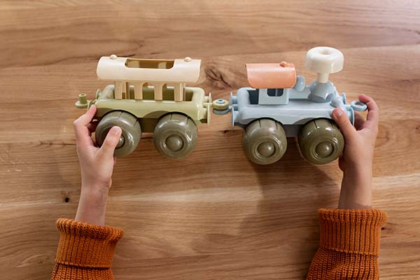 hands holding eco toy