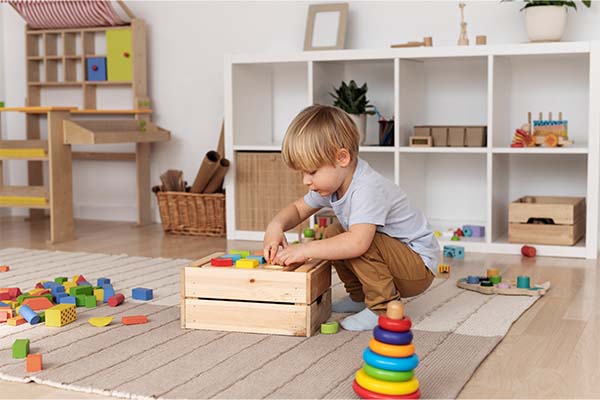 Boy arranging his toys