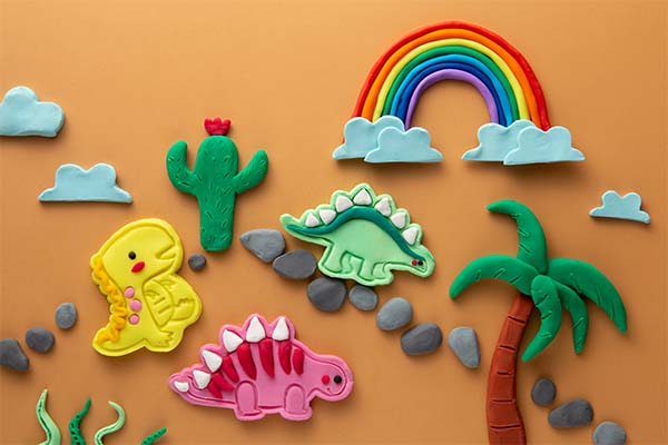 Play dough art with dinosaurus and rainbow