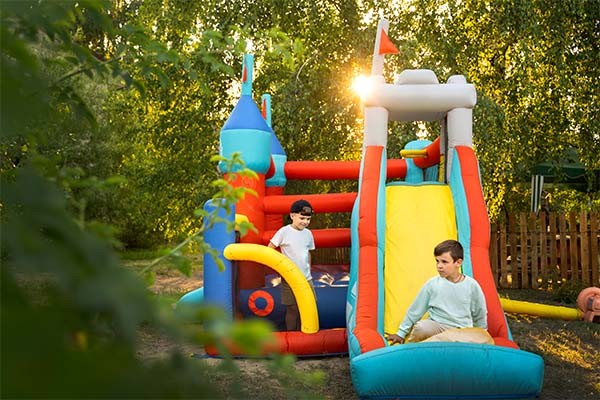  kid playing in bounce house