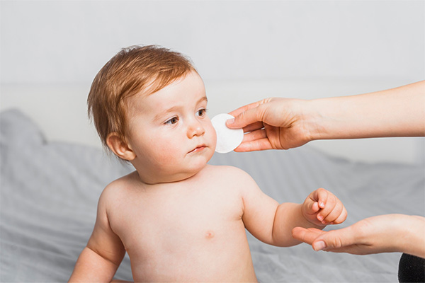 Baby cleaned with cotton baby wipes 