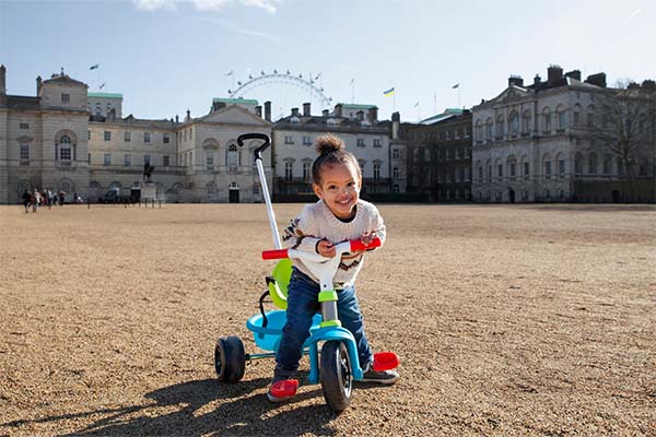 A little girl playing with outdoor toys 