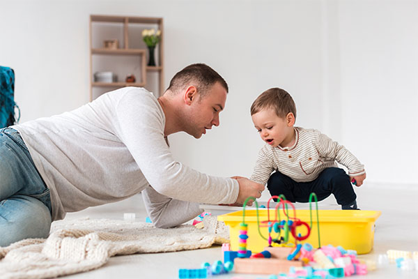 father playing with child