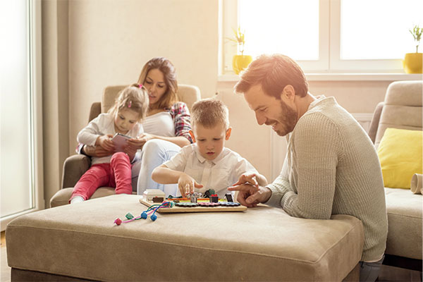 happy family reading and playing