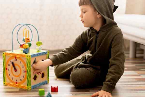 Full shot kid playing with box