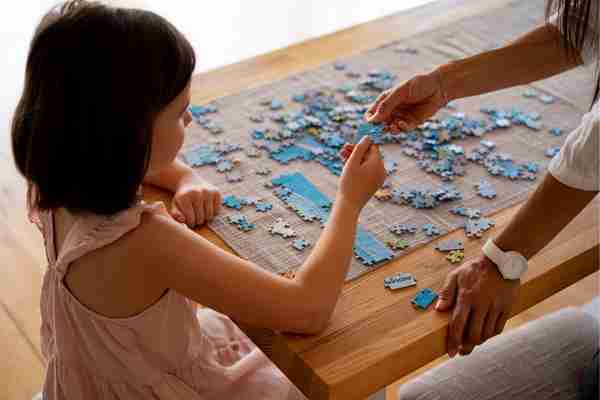 Girl playing with brain teaser toys